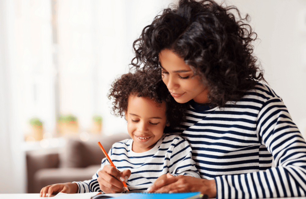 Parent and child writing together
