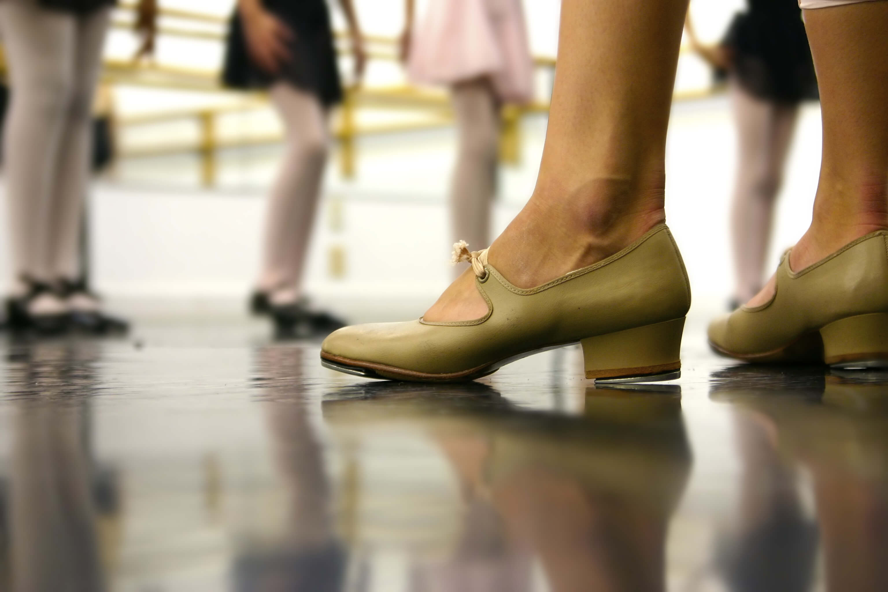 Lady teaching class in her dance shoes