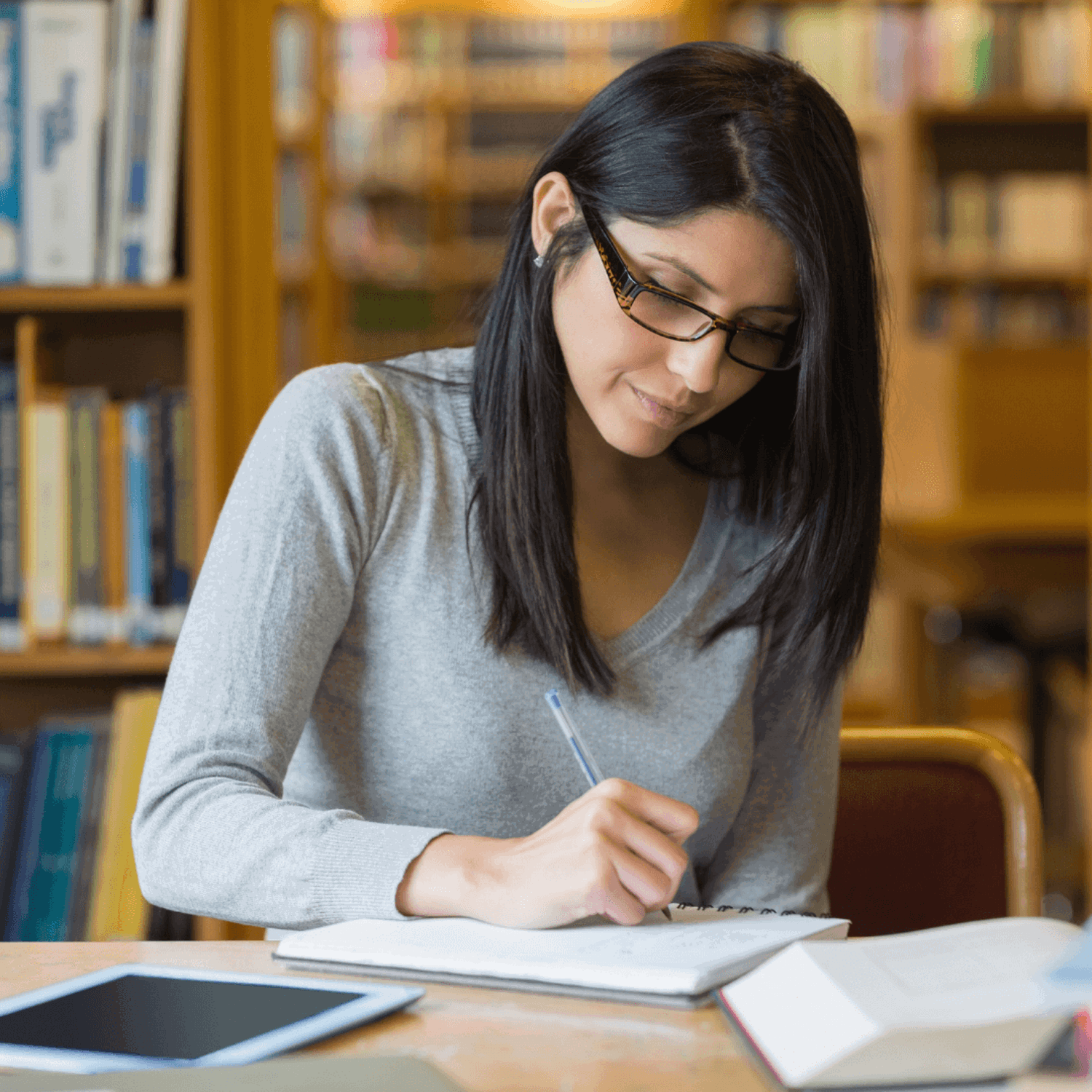 Lady writing in notebook