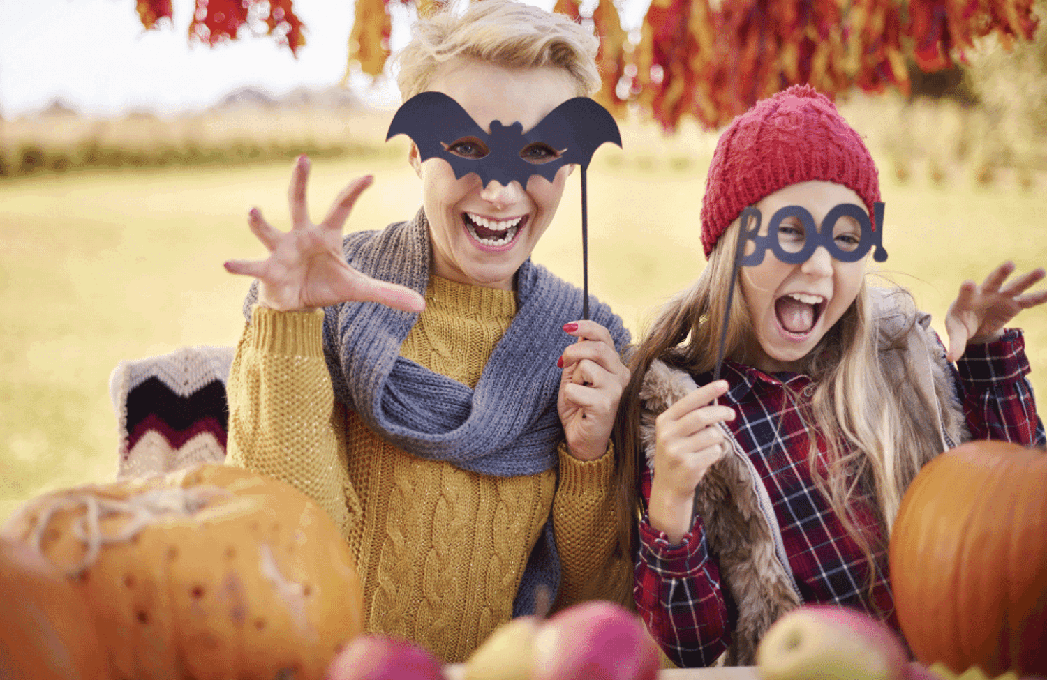 People wearing halloween masks