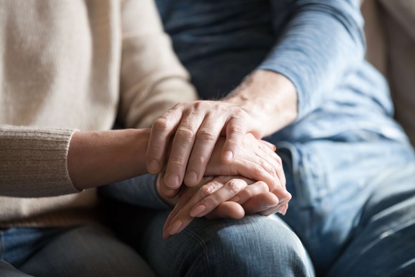 man and woman holding hands