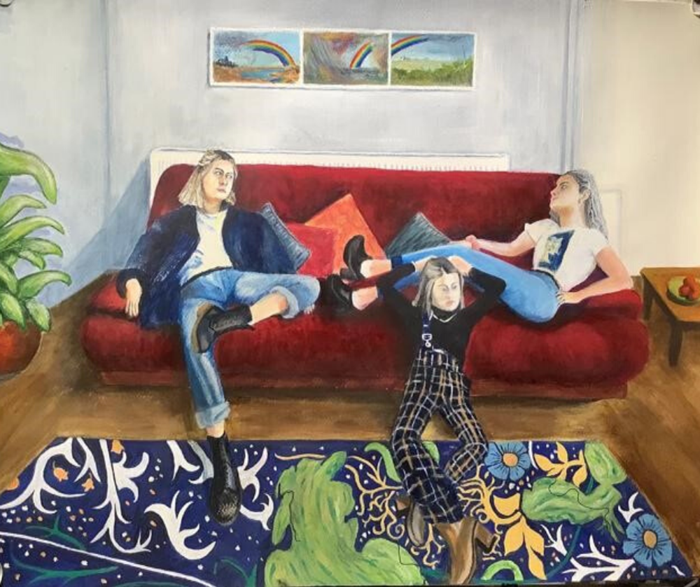 Learner painting depicting three young women lounging on a sofa
