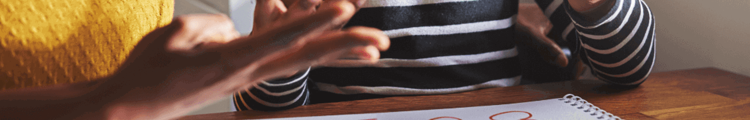Woman doing sums with girl
