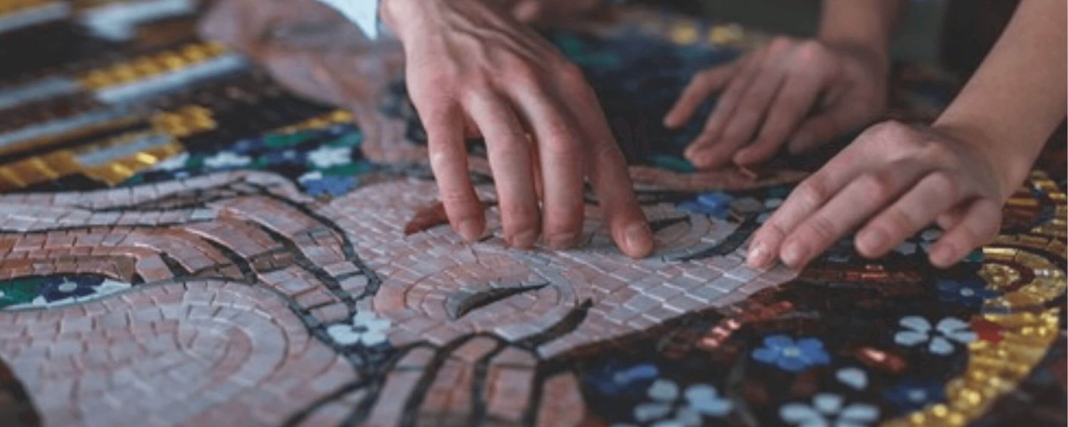 Person touching mosaic