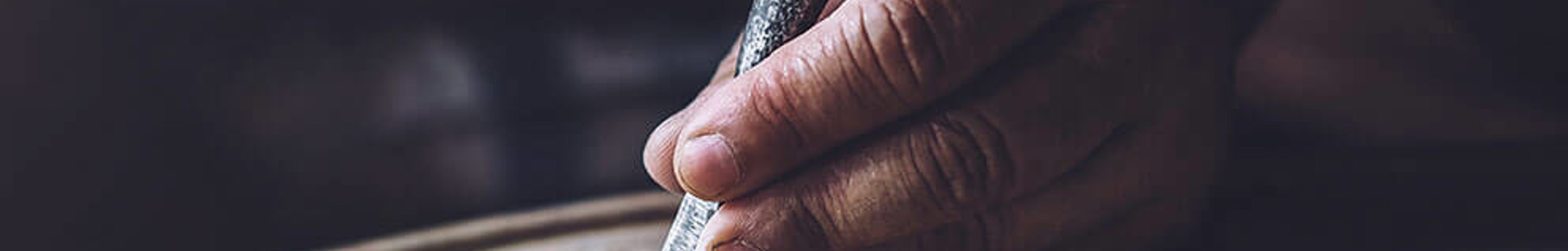 Someone carving a sculpture