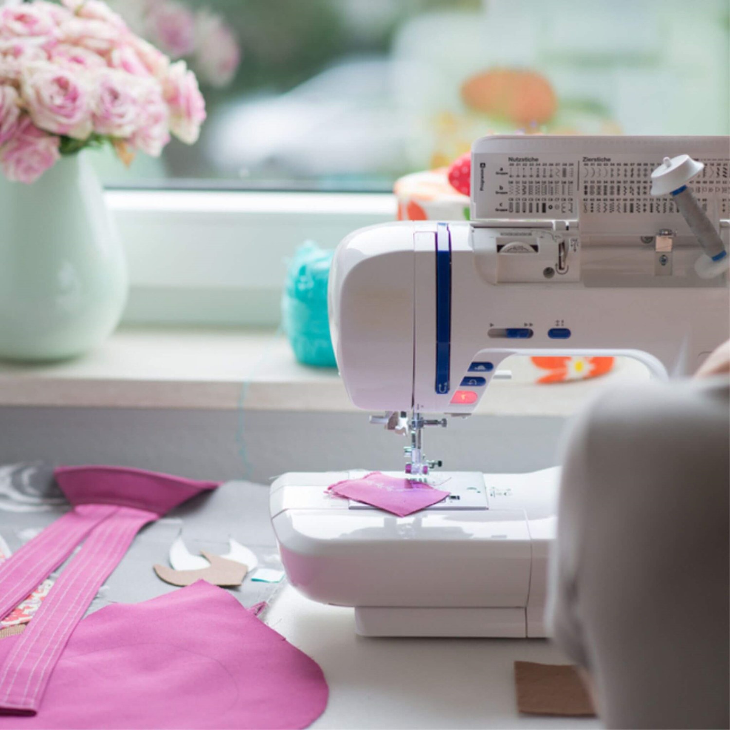Person sewing at machine