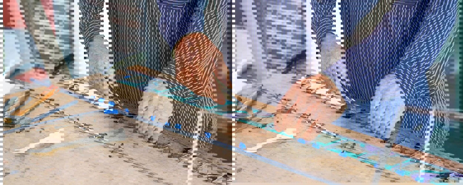 Man cutting glass
