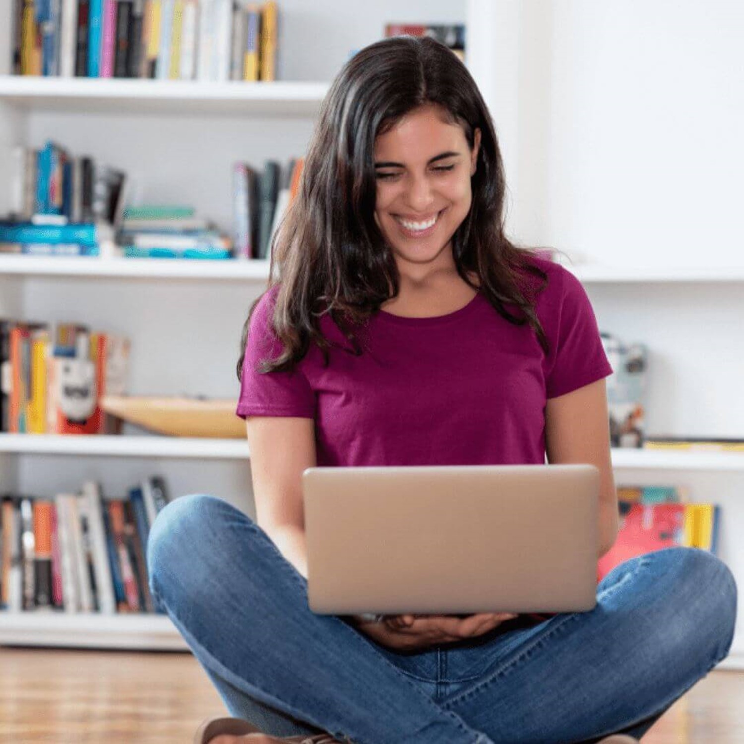 Girl smiling on laptop