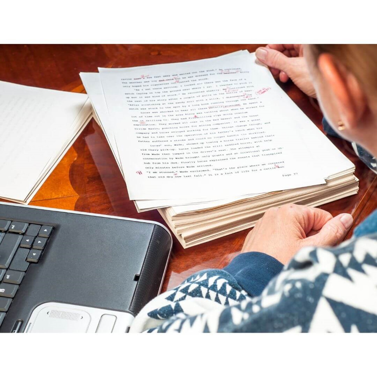 Person proof reading text