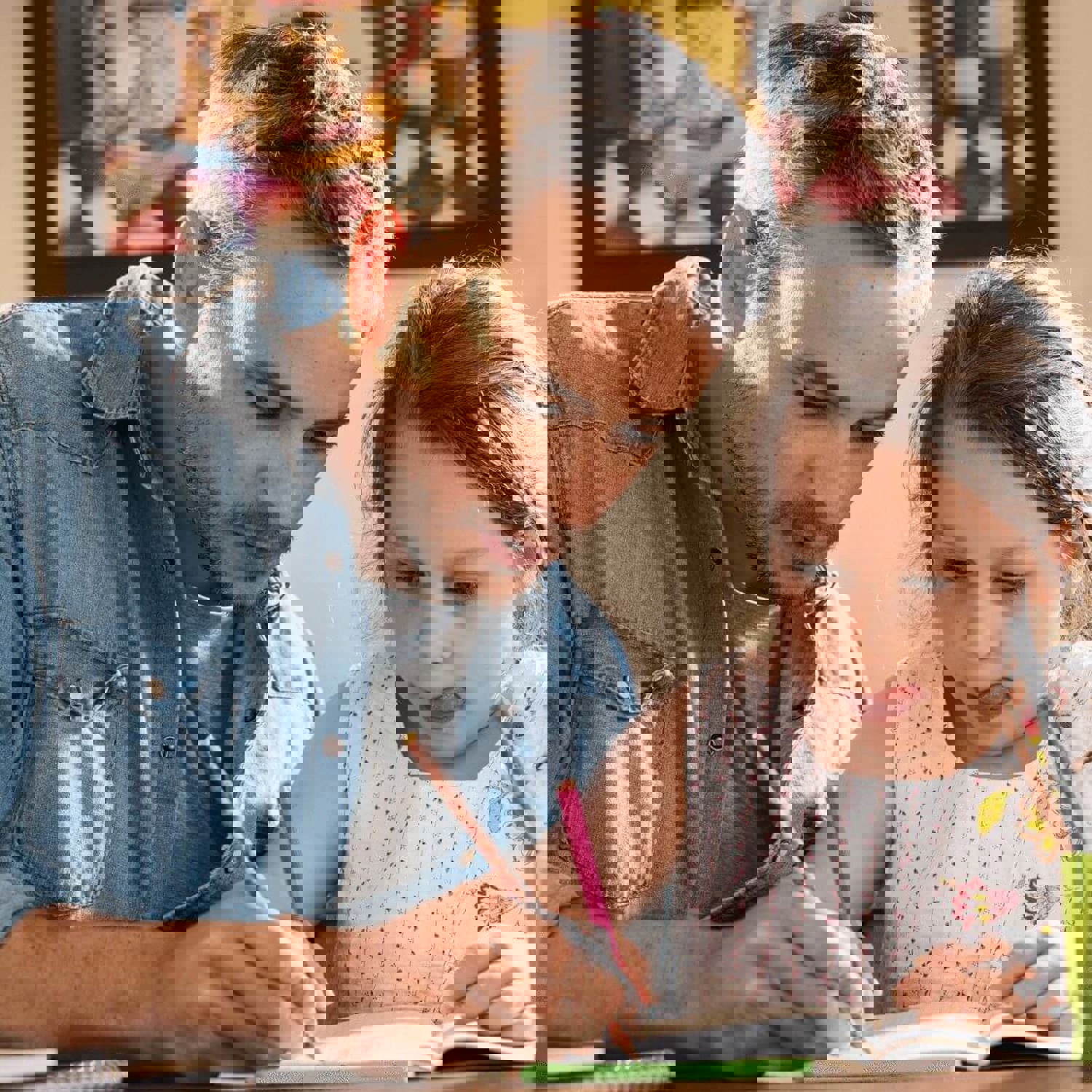 Dad colouring with daughter 