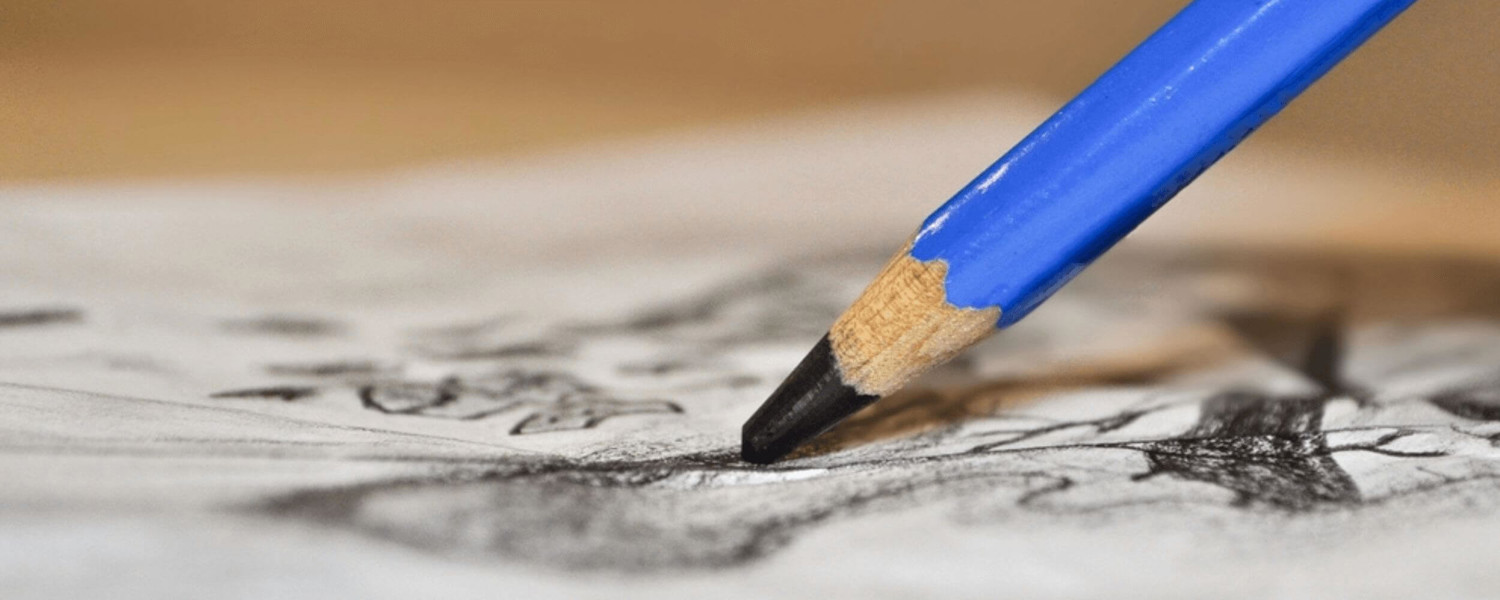 Person using a pencil to draw
