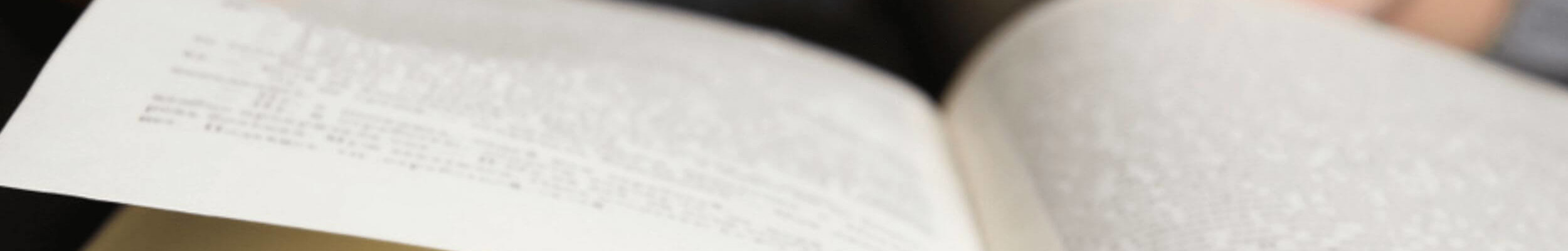 Close up of person reading book