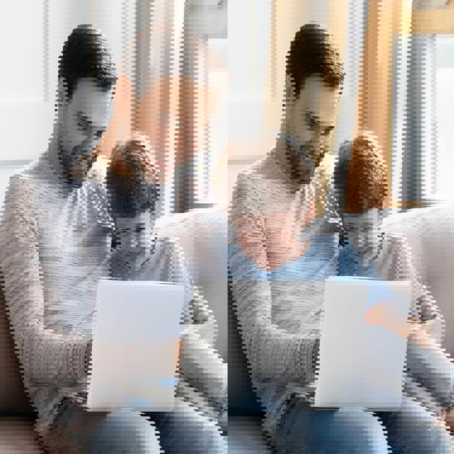 Man and boy on laptop