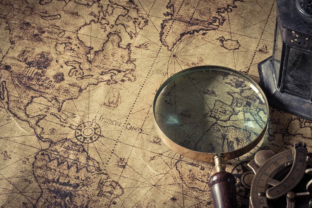 Magnifying glass on an old map