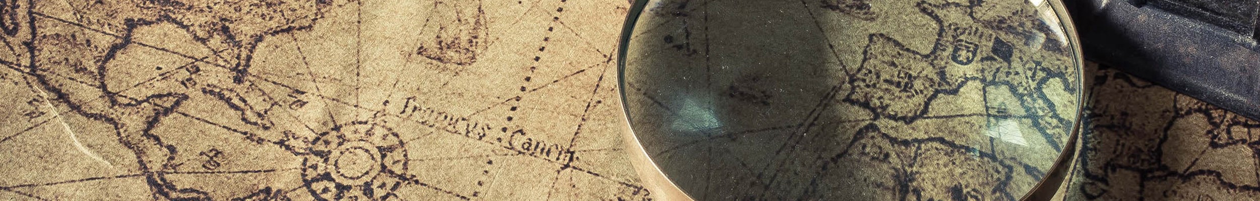 Magnifying glass on an old map