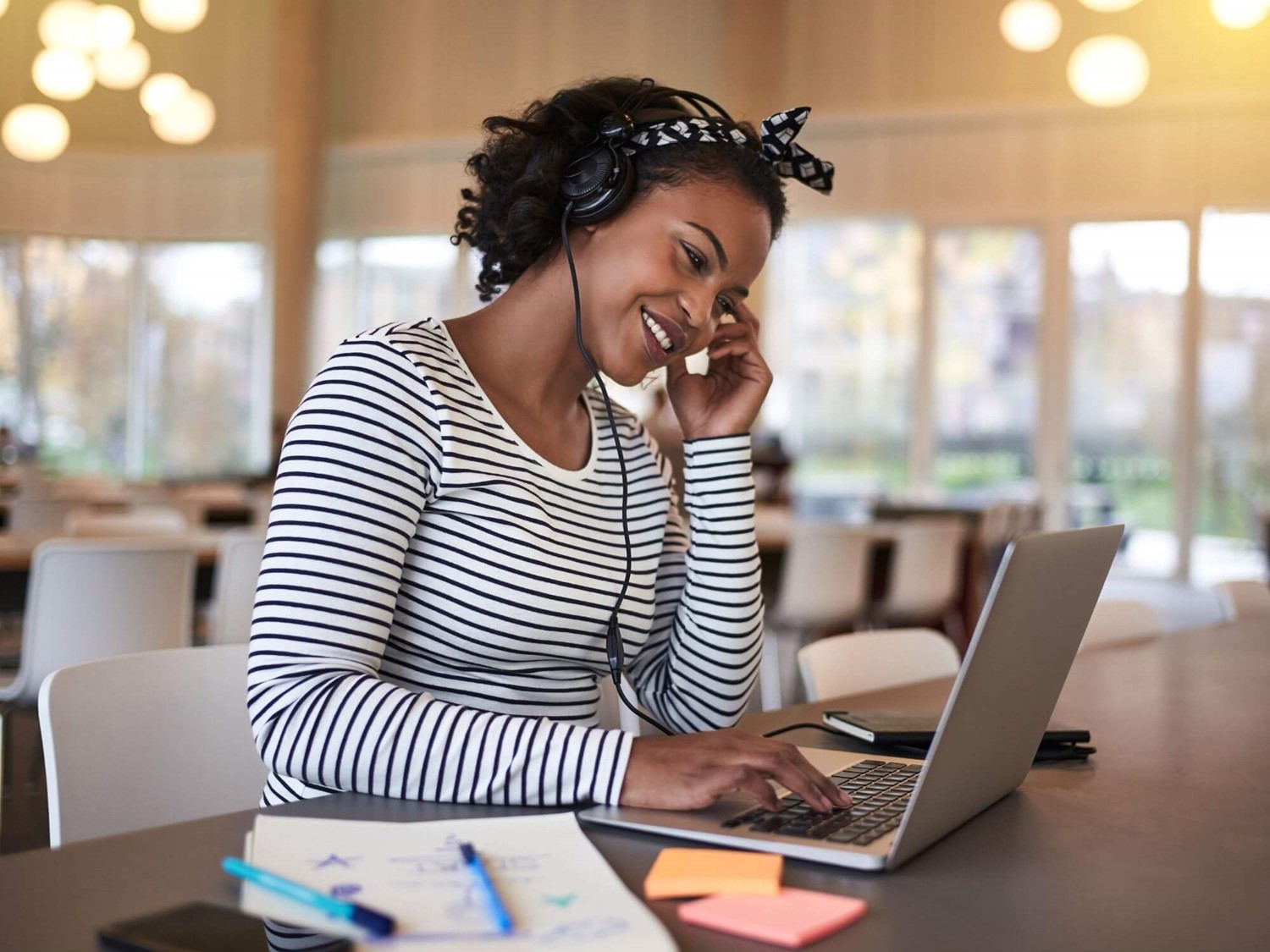 Woman smiling on laptop