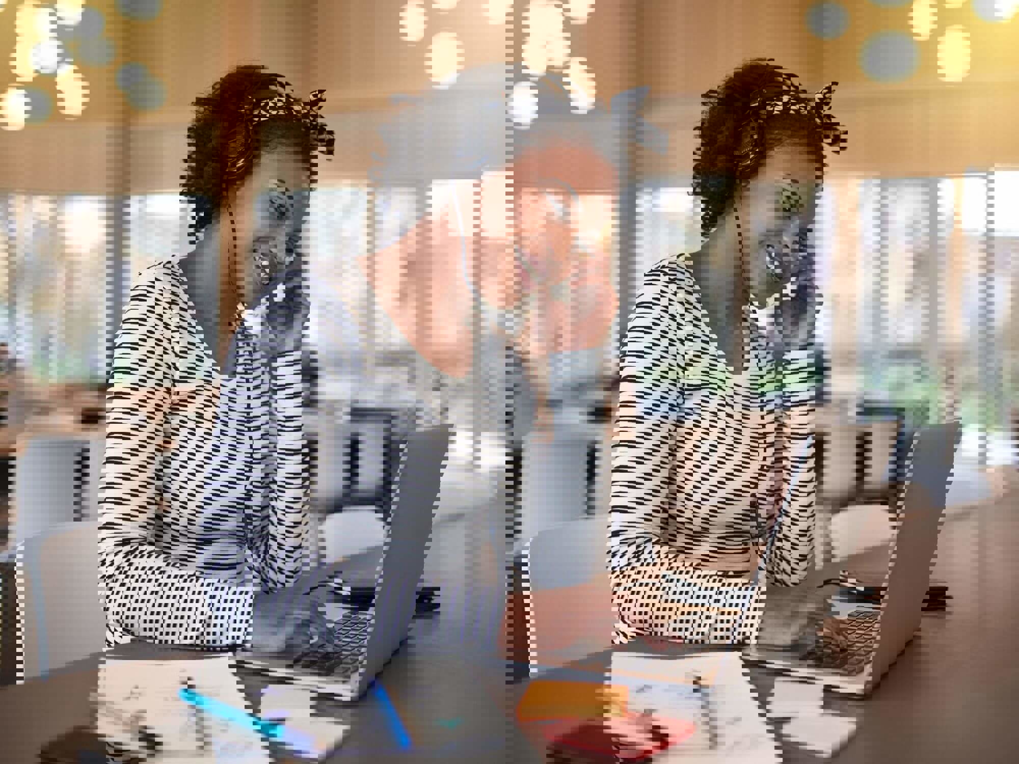 Woman smiling on laptop