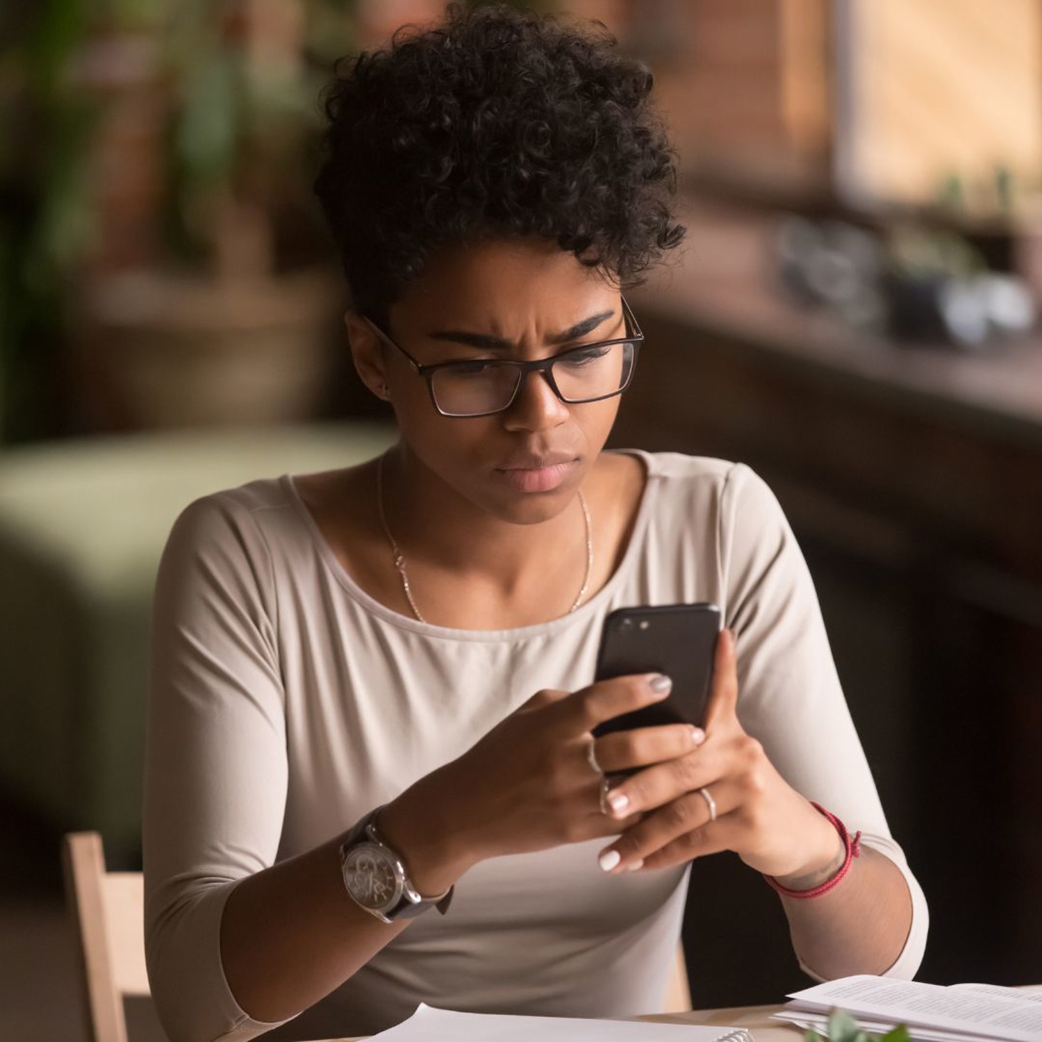 Concerned person looking at a phone