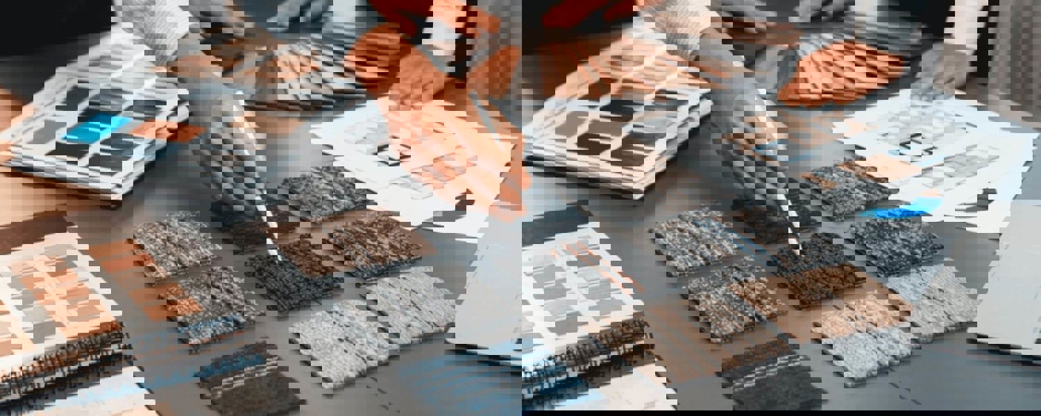 Person pointing at fabric samples