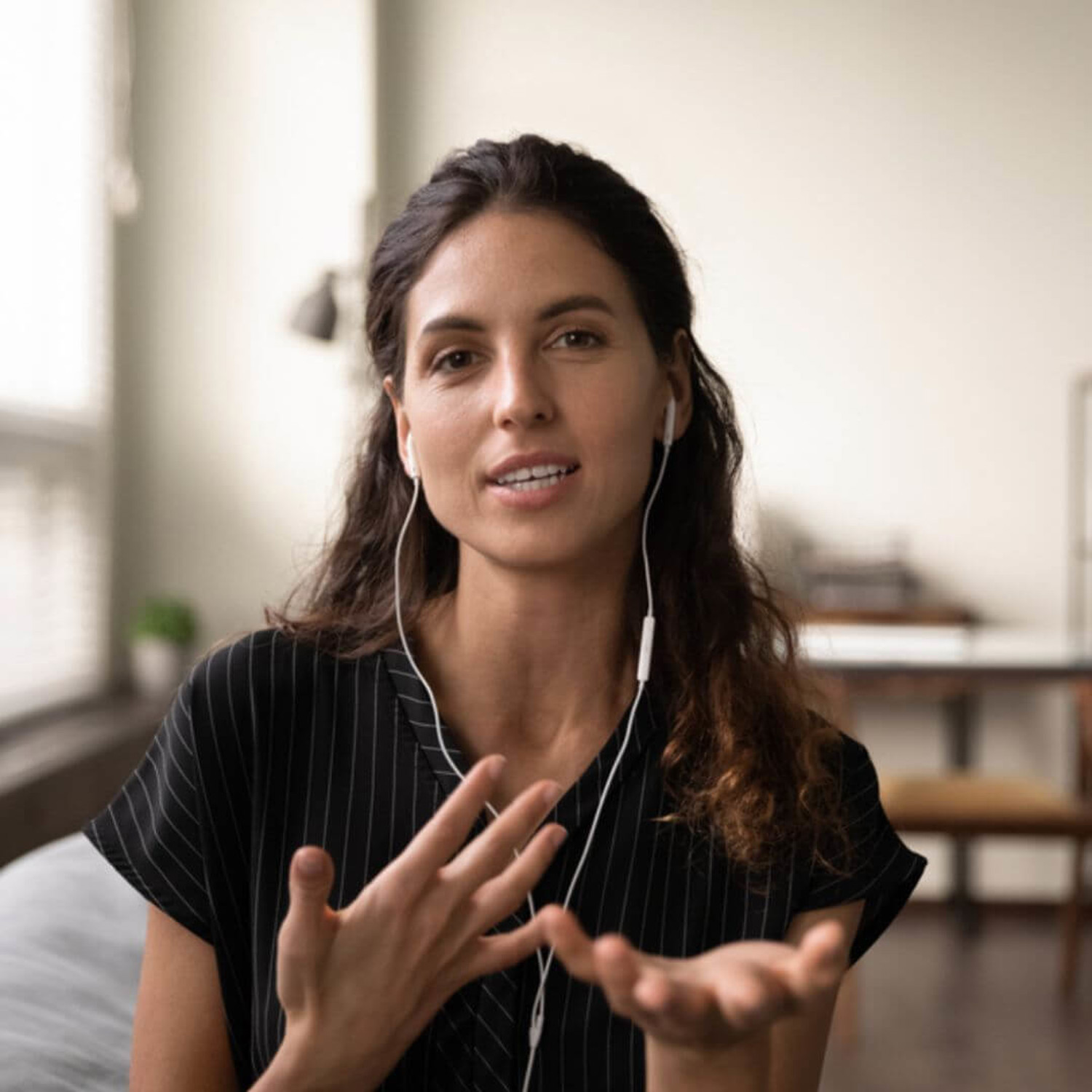 Woman speaking with headphones in
