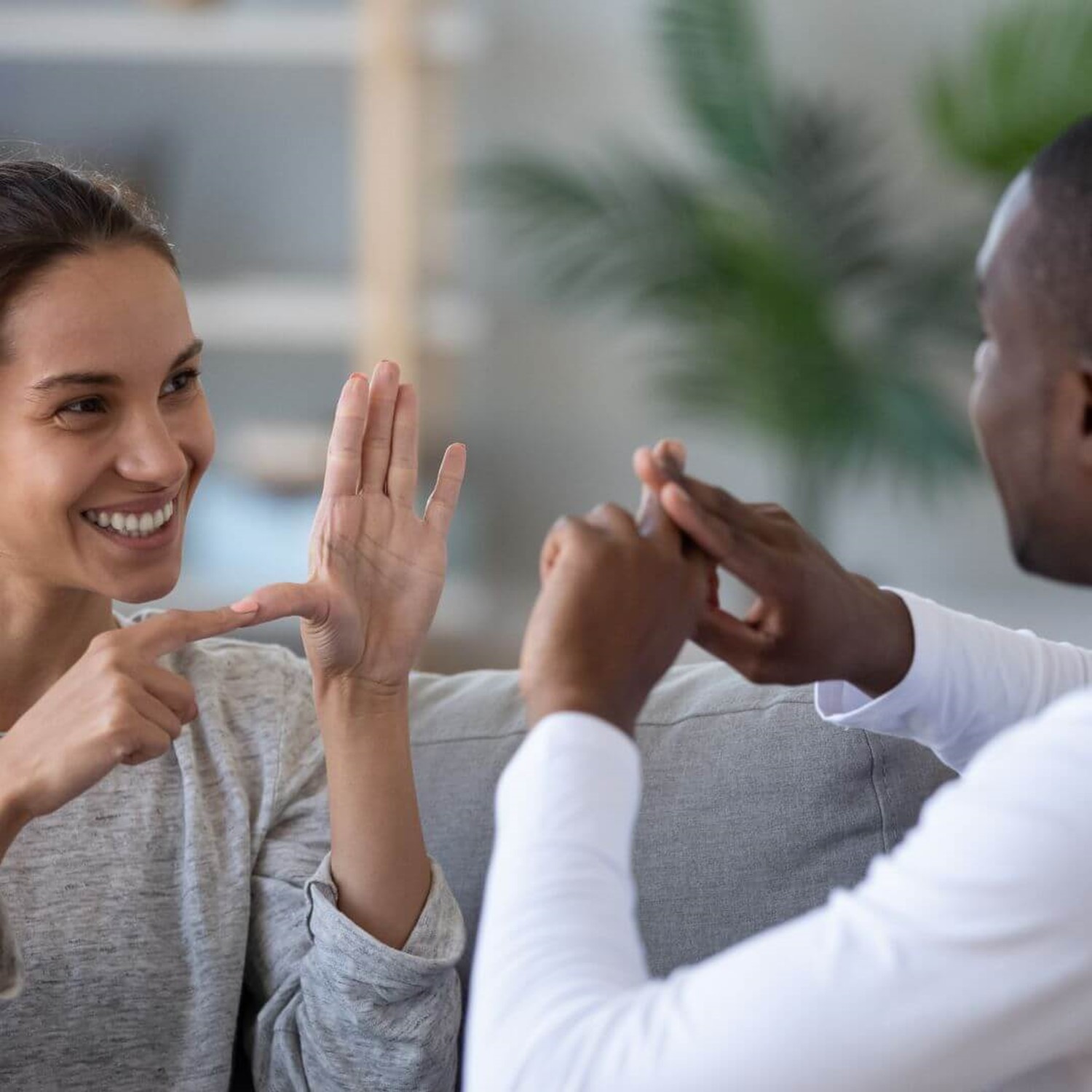 Two people communicating in sign language