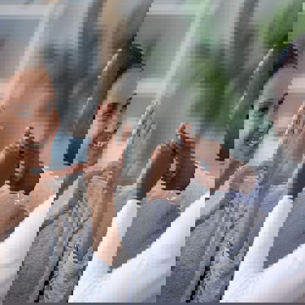 Two people communicating in sign language