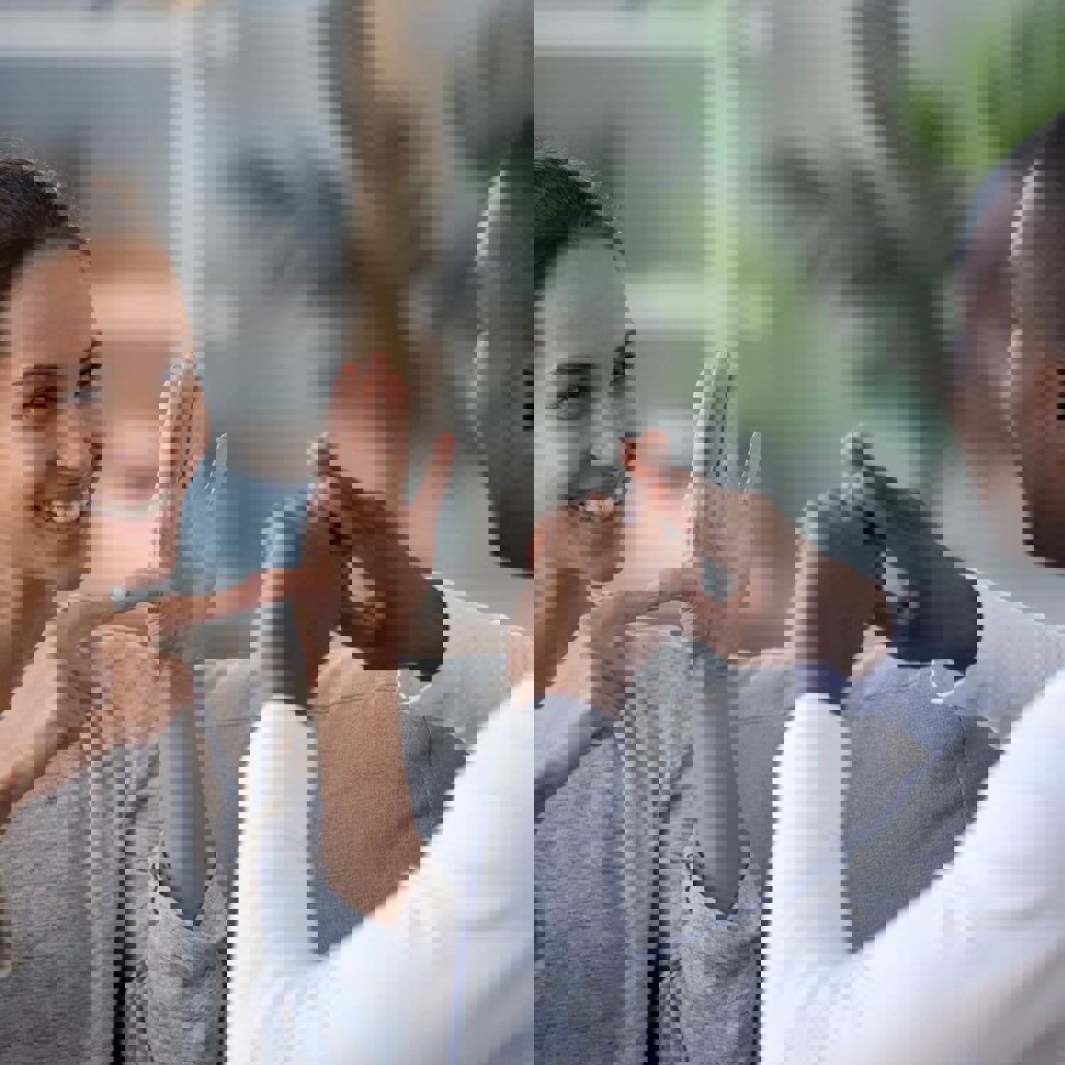 Two people communicating in sign language