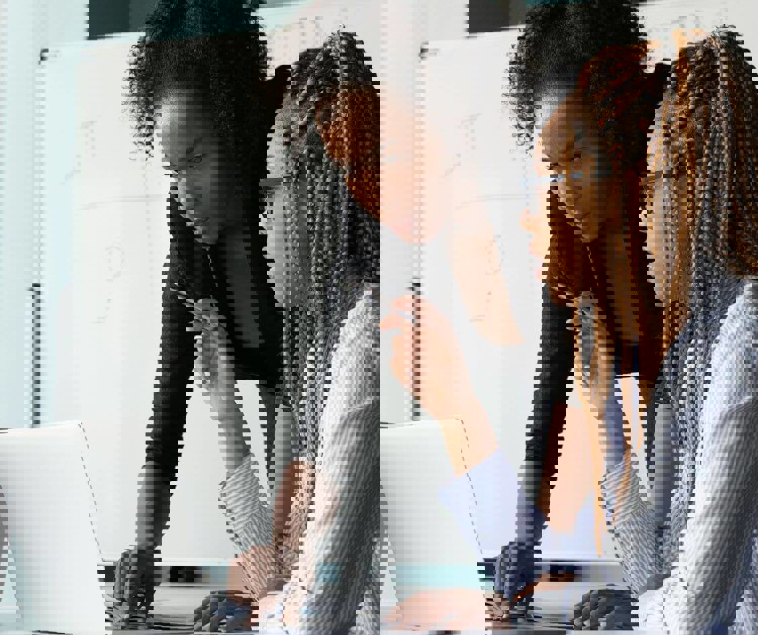 Two women looking at a computer screen