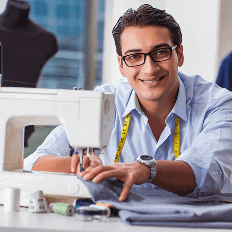 Man at sewing machine