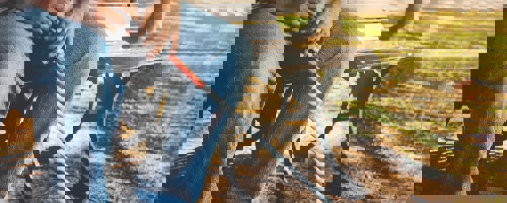 Blind man sitting on a bench in a park