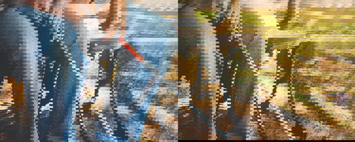 Blind man sitting on a bench in a park