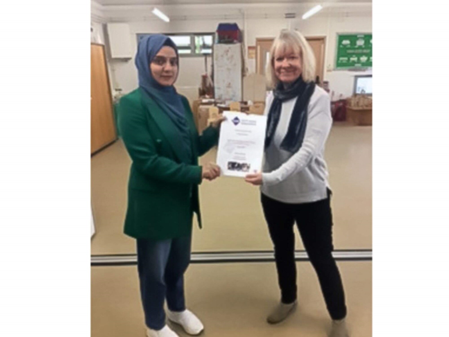 Learner being presented with a certificate