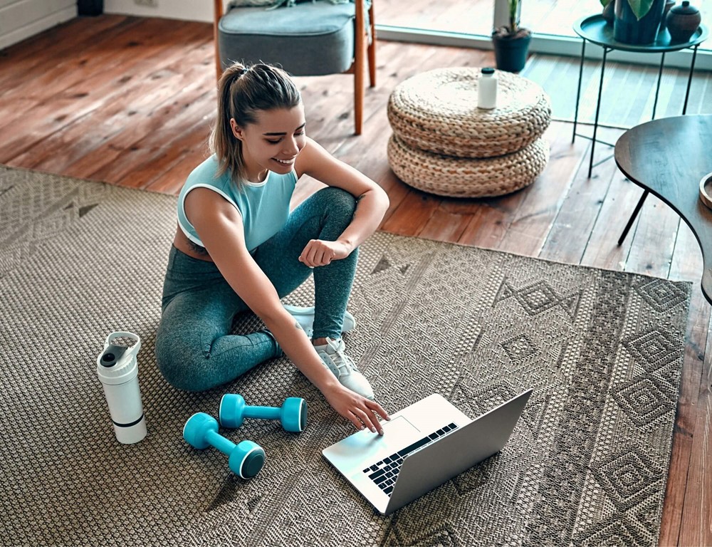 Woman using a computer for online fitness