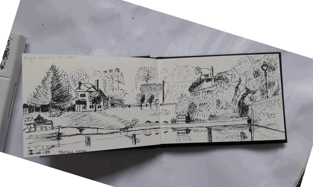 Photo of drawing of houses in sketchbook