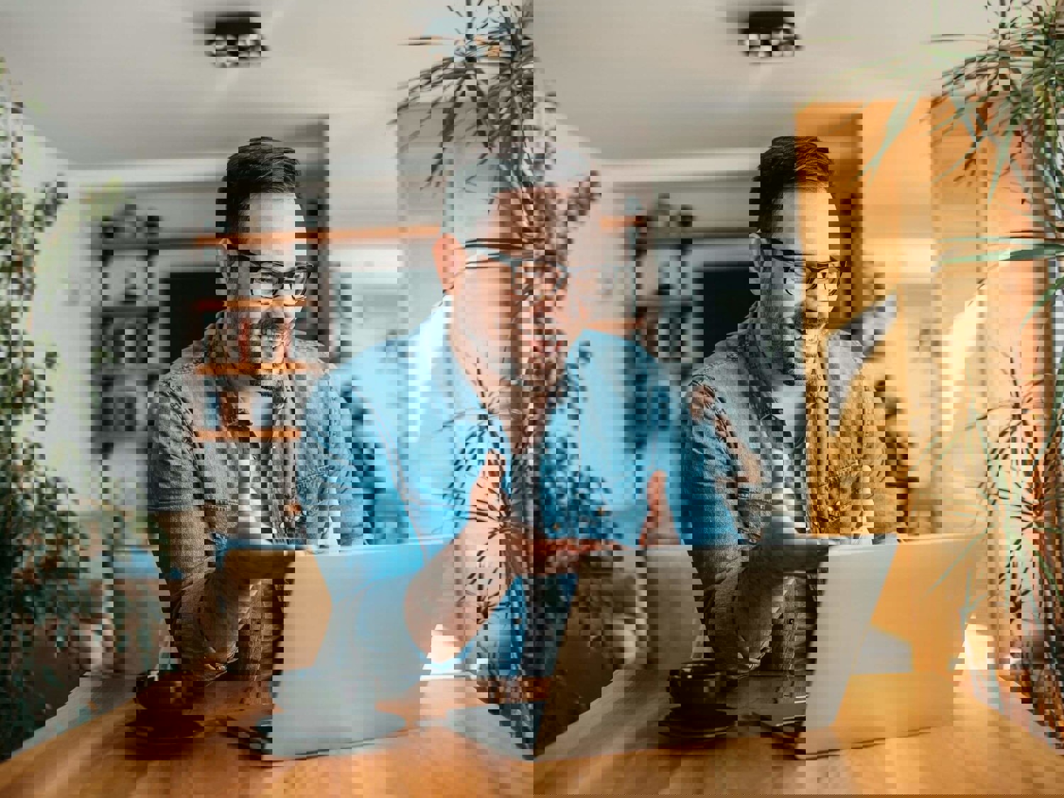 Man talking on laptop