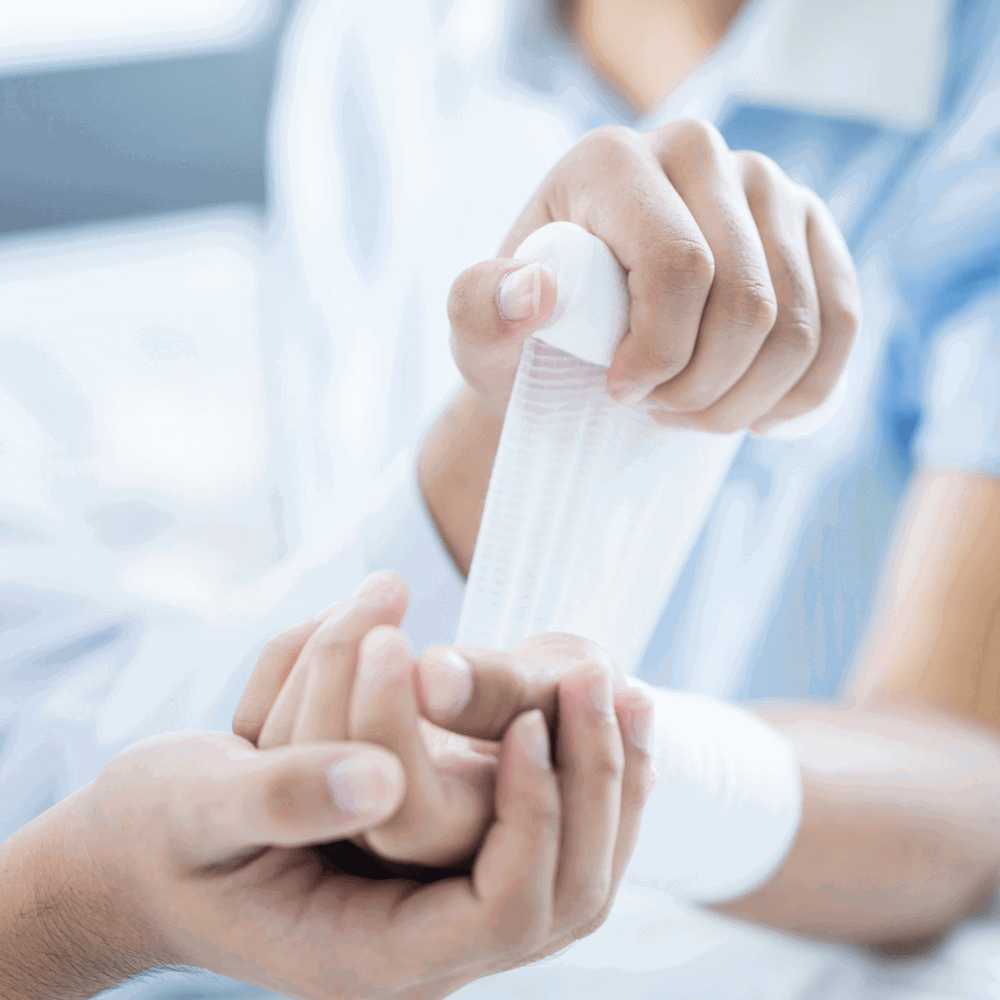 A hand being bandaged up