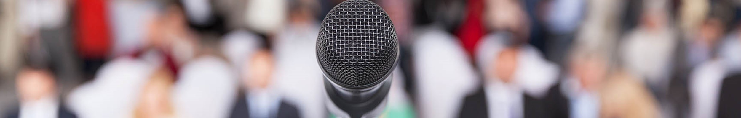 A microphone in front of an audience