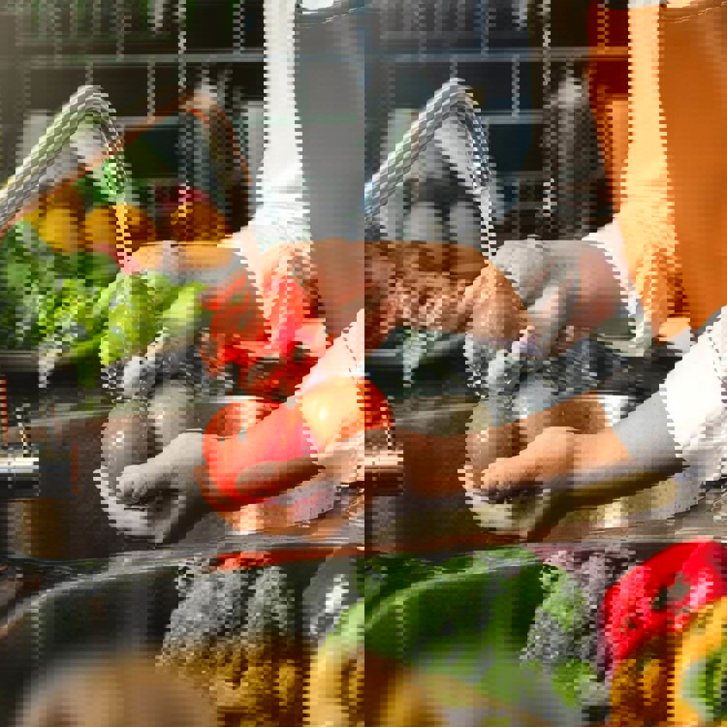 Person washing vegetables