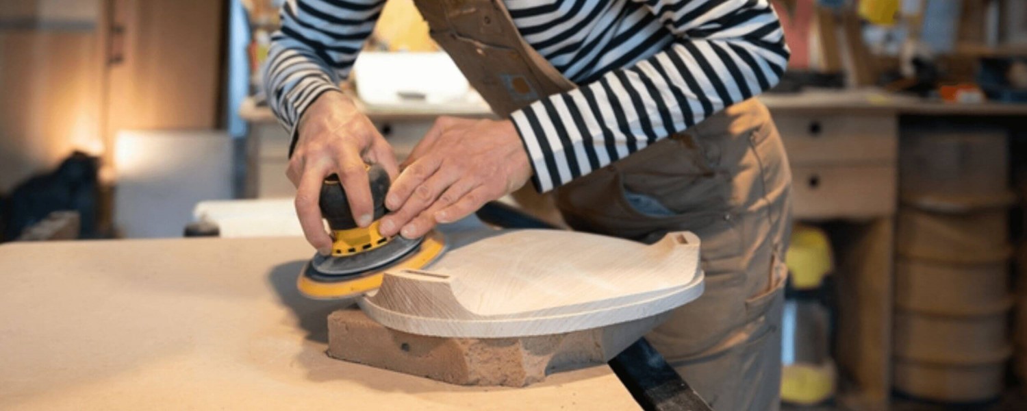 Man sanding wood