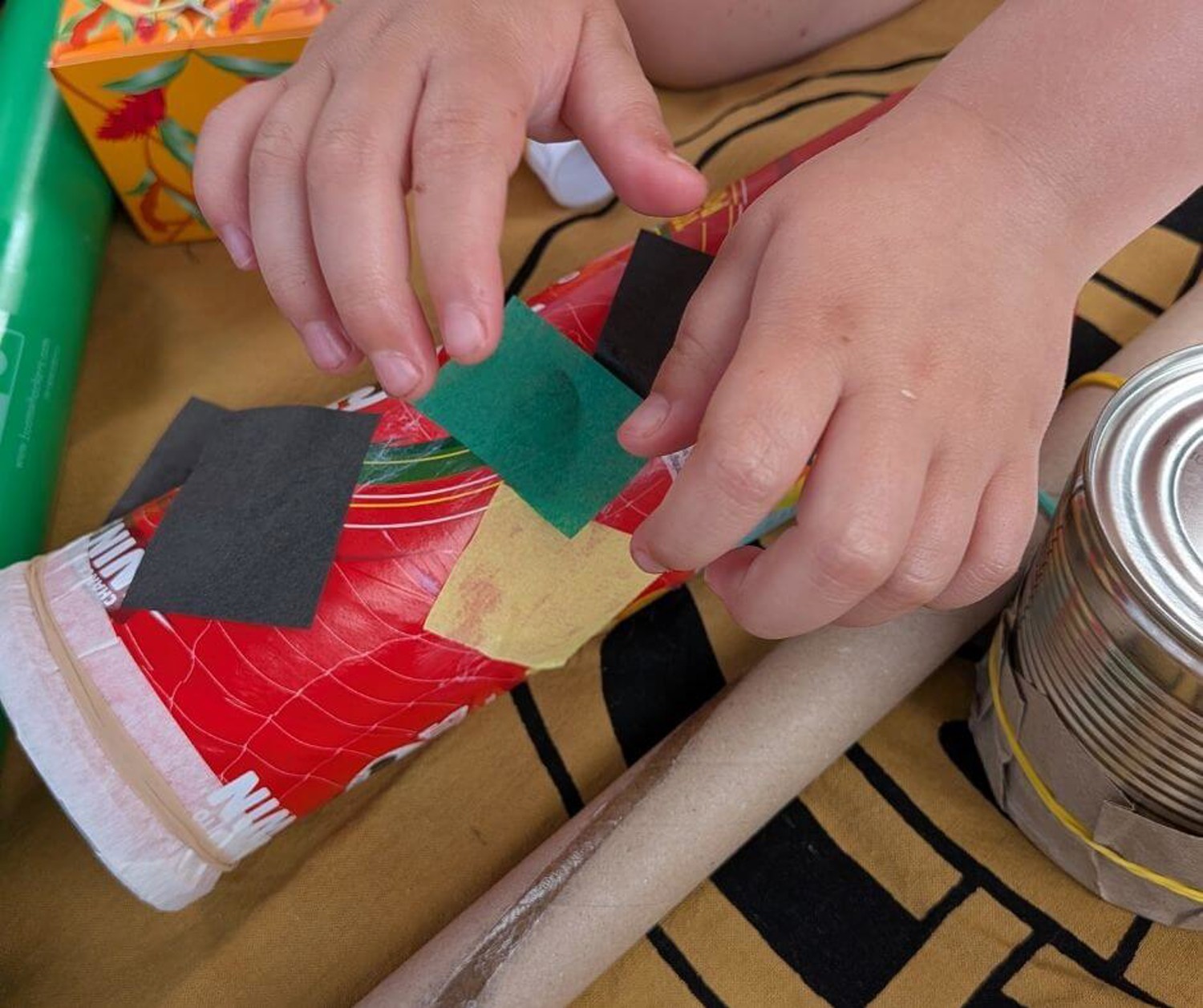 Child making musical instruments
