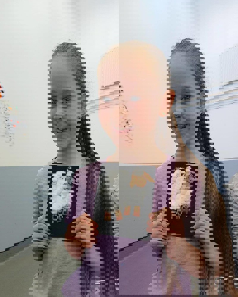 Child holding their Easter craft