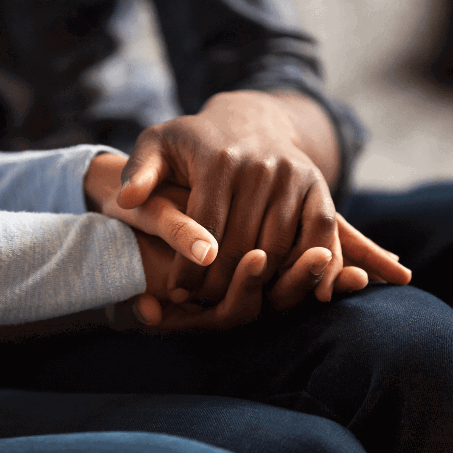 Two peoples hands together