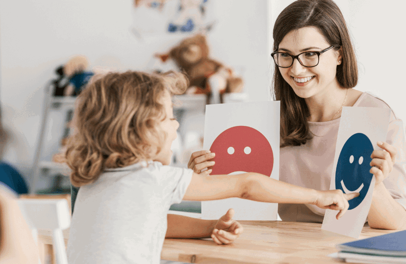 Parent and child looking at flashcards
