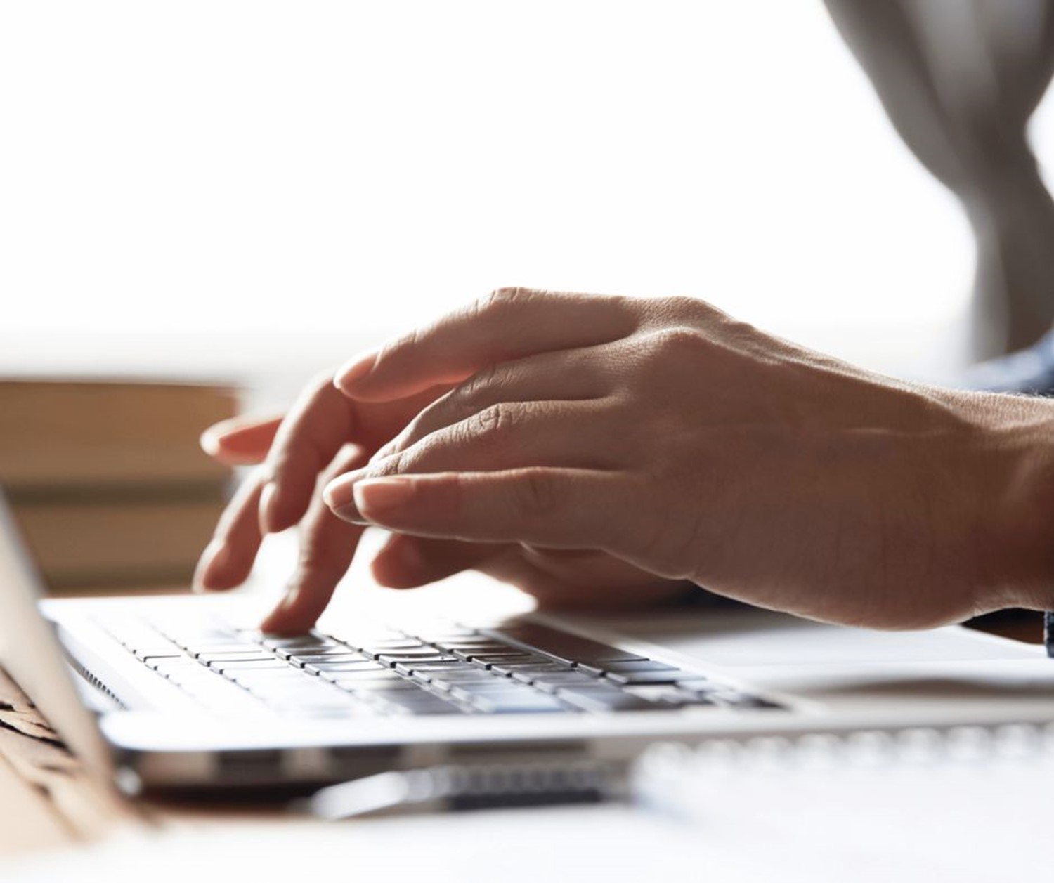 Typing on laptop