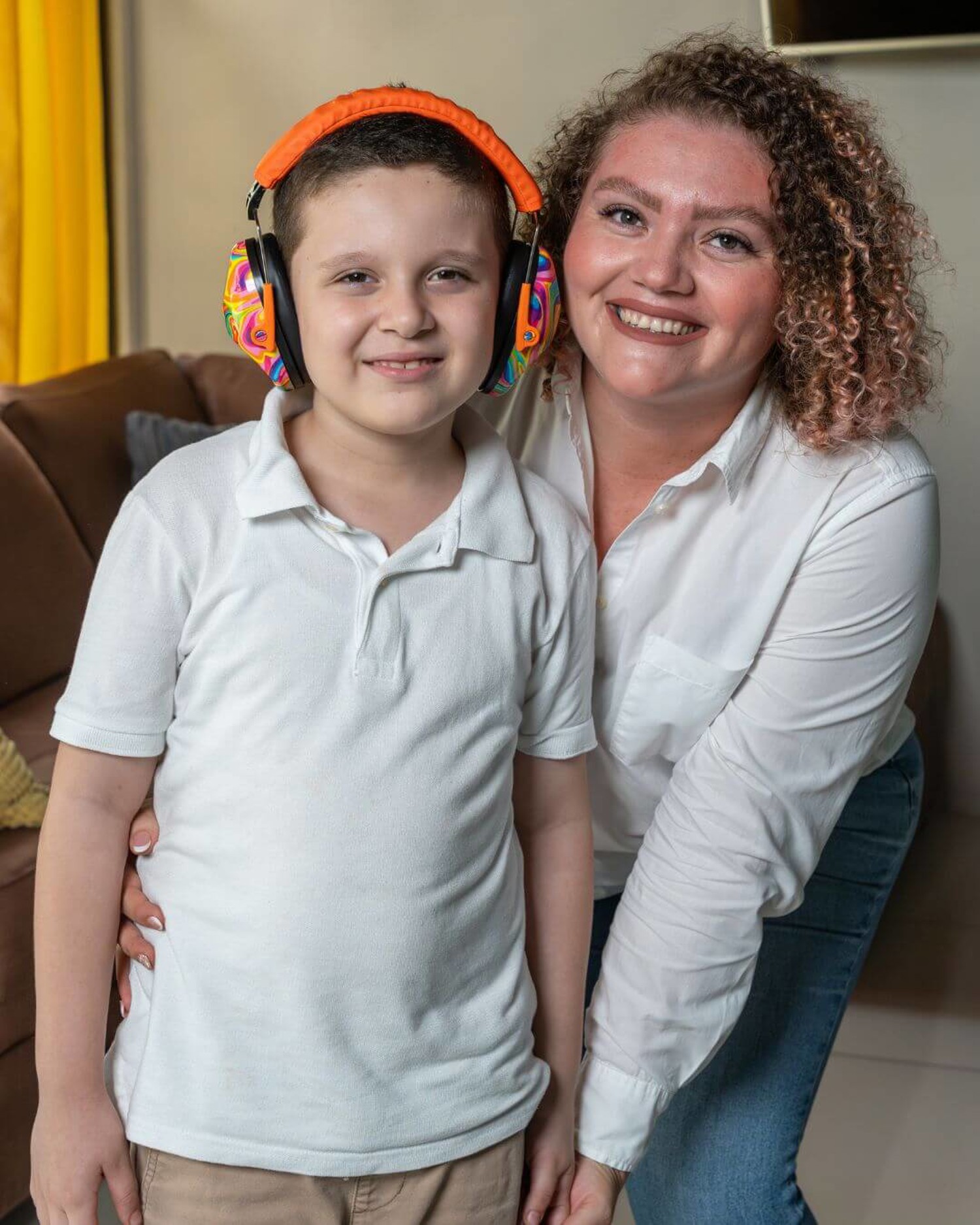 parent and child wearing headphones smiling