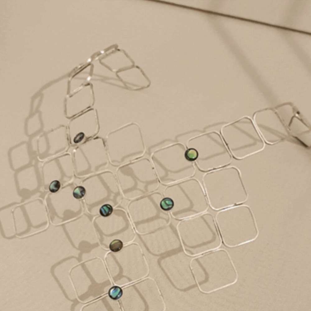 Silver detailed necklace with gem stones