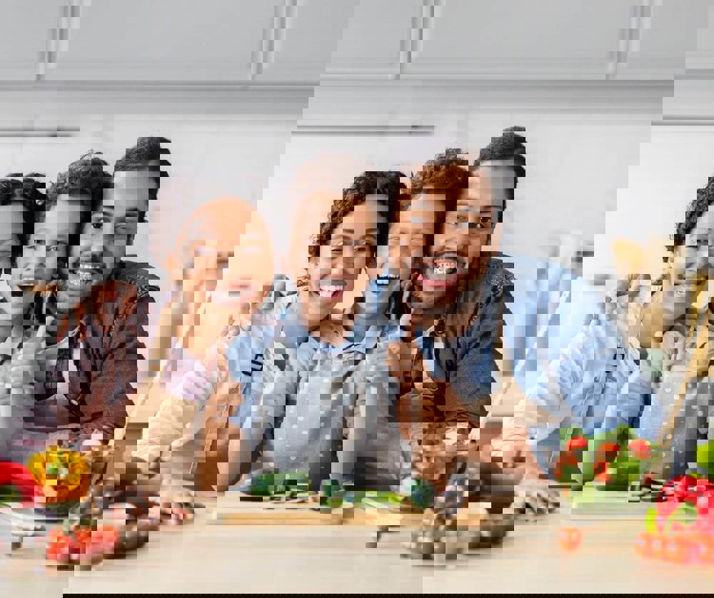 Parents and child preparing a healthy meal together