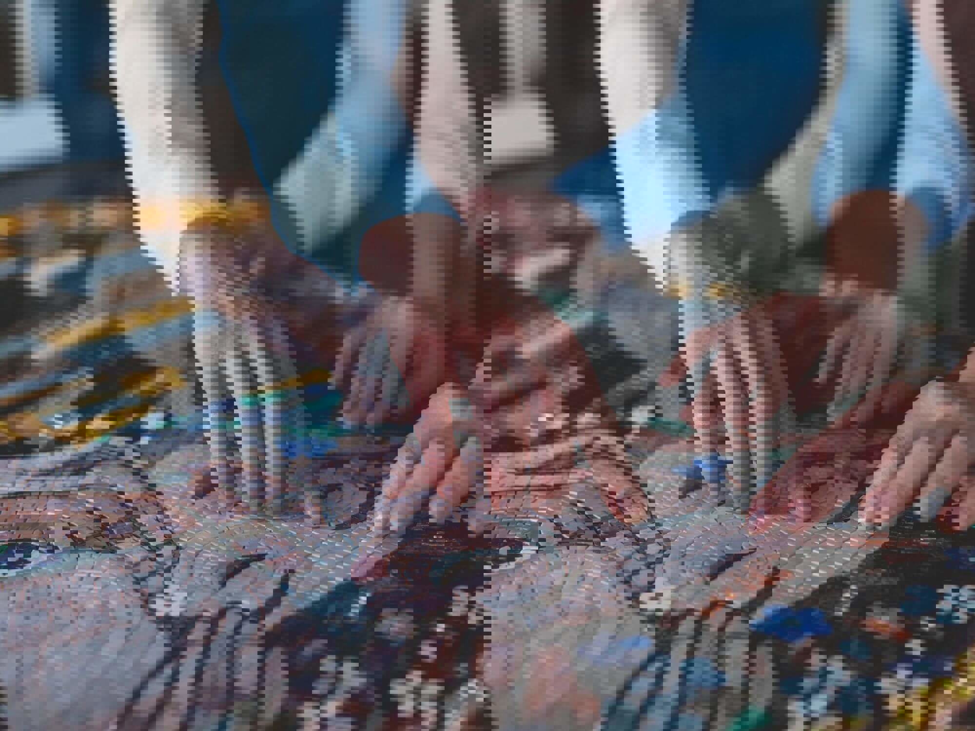 Two people creating a mosaic