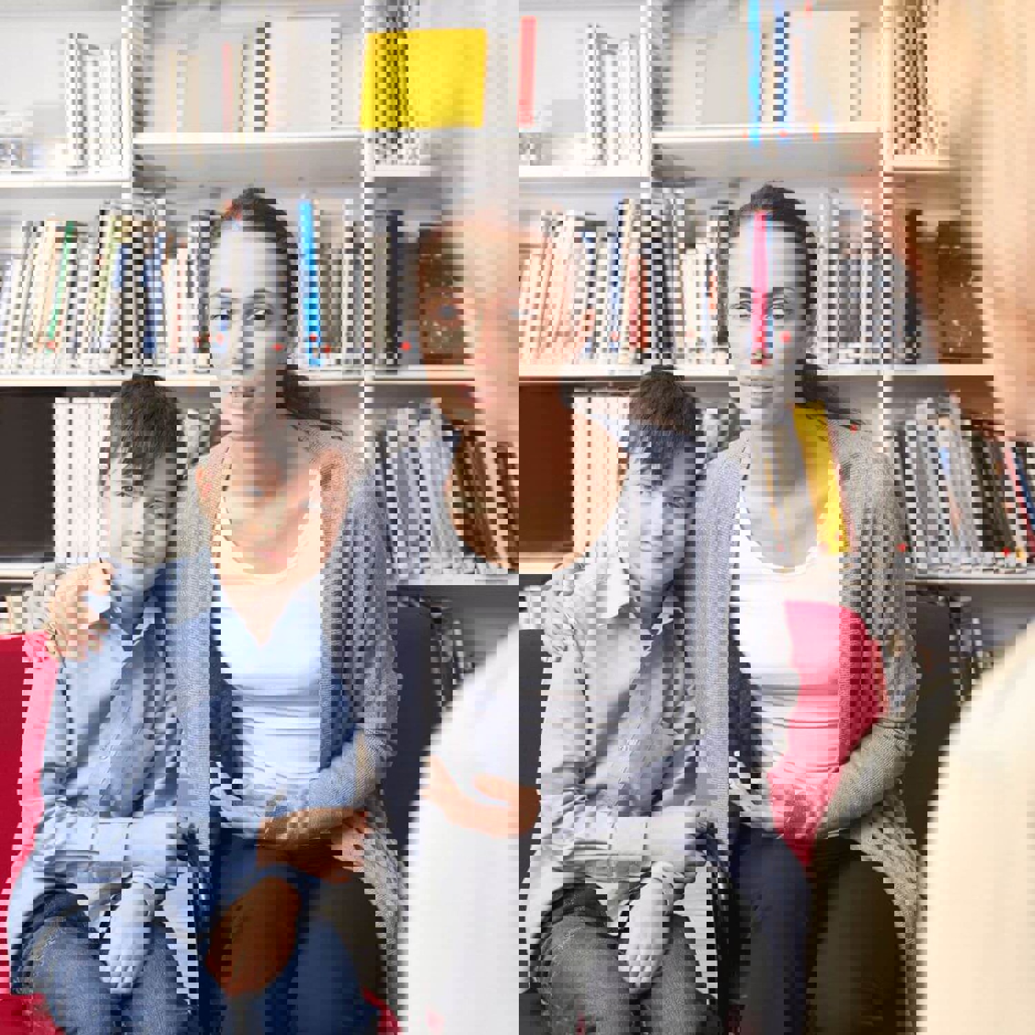 Mum with arms around son while talking to lady in library
