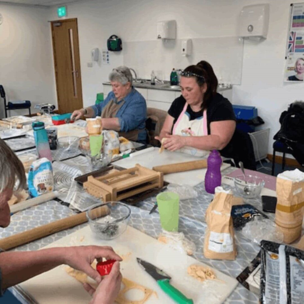 Learners cutting pasta